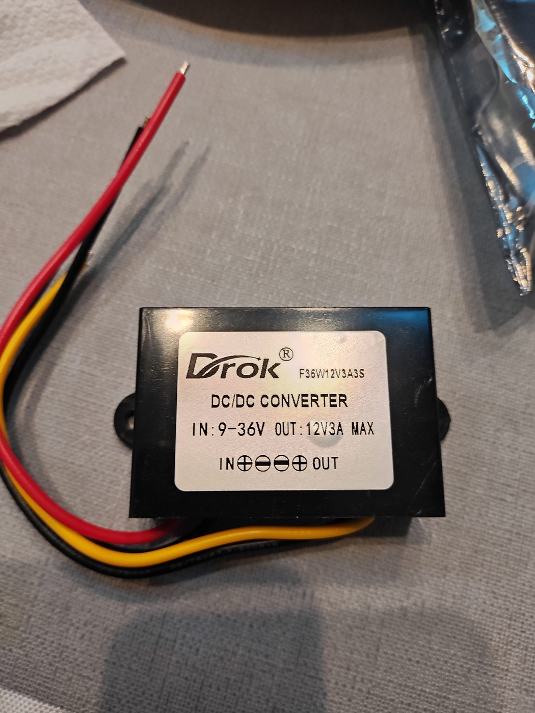 Weatherproof DROK DC to DC voltage regulator used to provide regulated 12-volt power