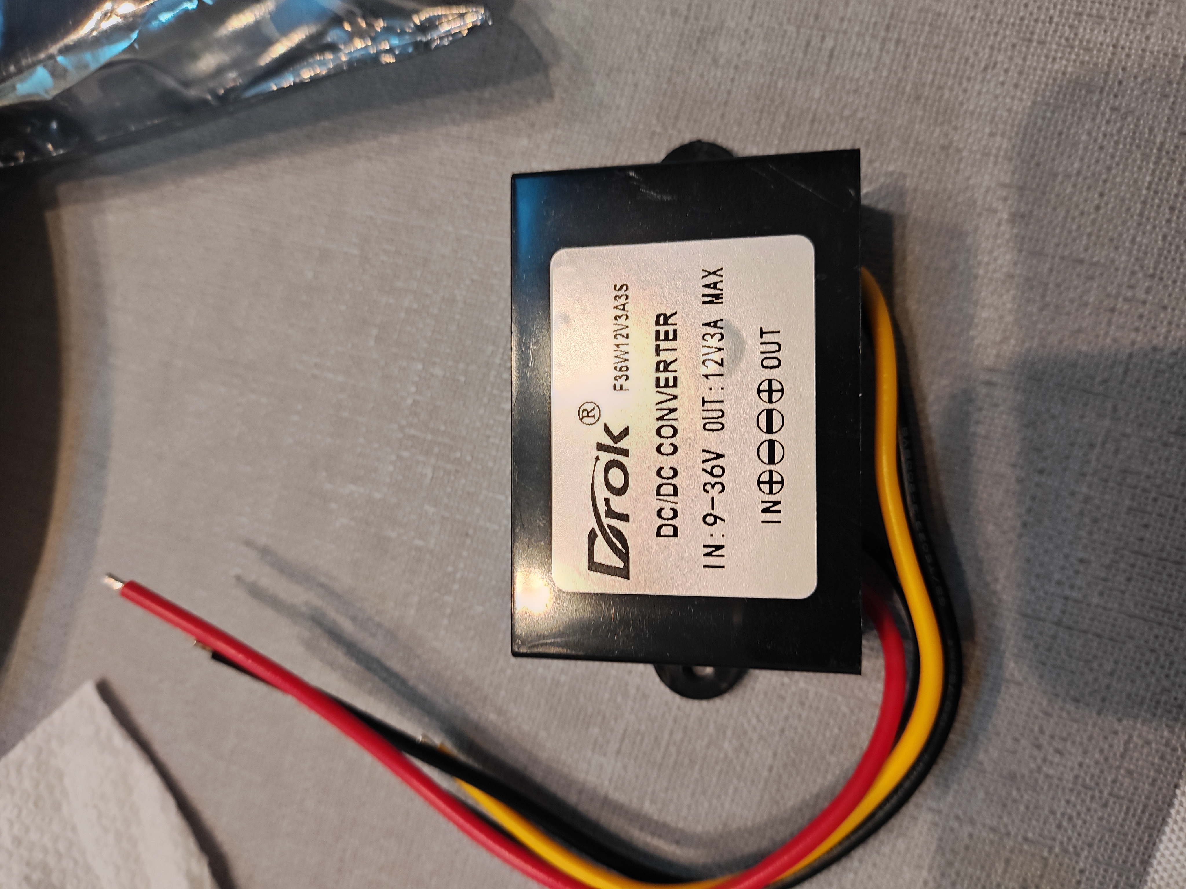Weatherproof DROK DC to DC voltage regulator used to provide regulated 12-volt power